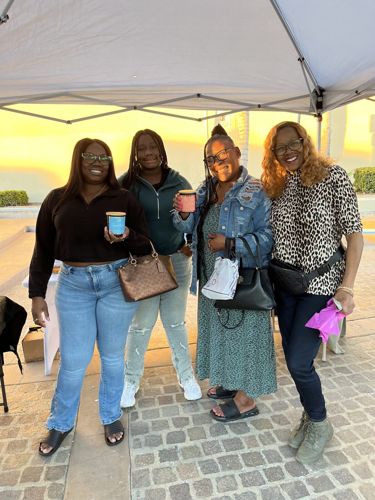 Debbie smiling with customers at Monday Market